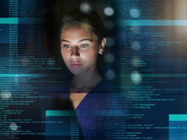 A lady watching data on big screen