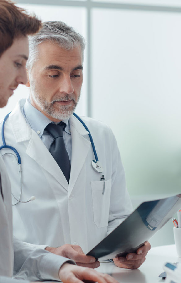 Two male doctors looking at documents