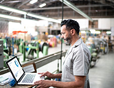 man looking at laptop