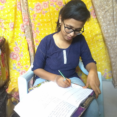 Girl writing in her notebook