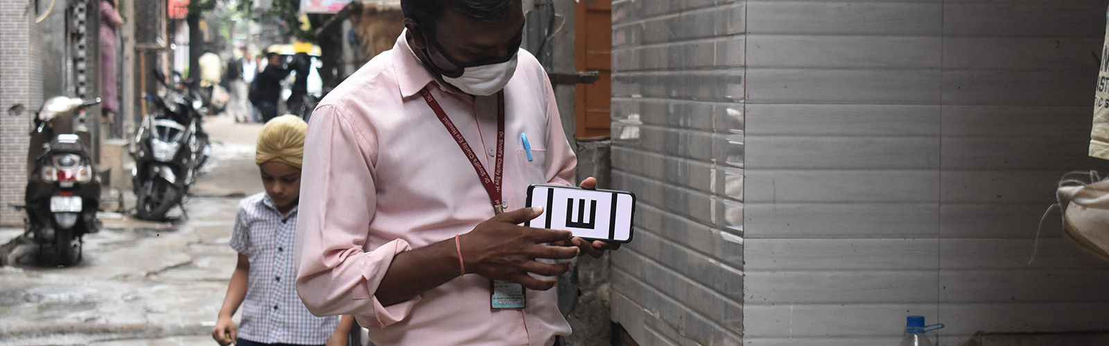 A man is holding something in his hand