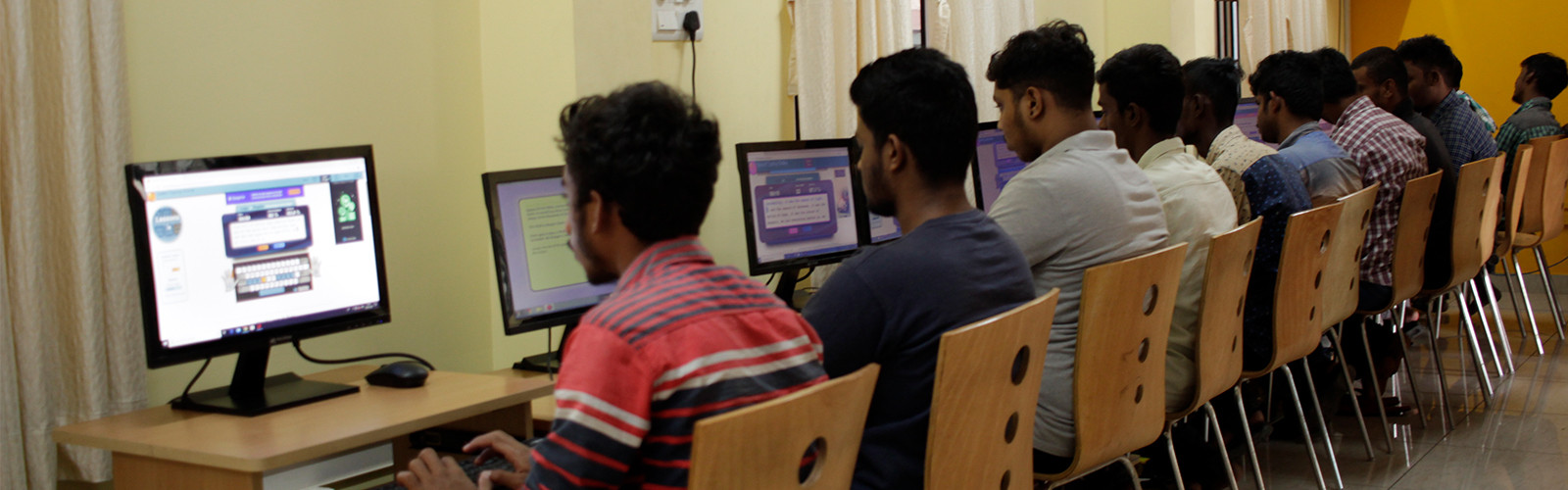 Students are sitting and doing practical in lab