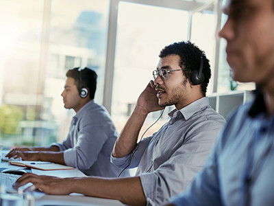 A group of three people working