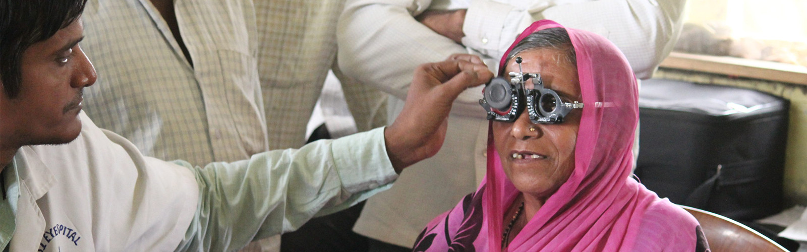 Doctor is checking a eyesight for women