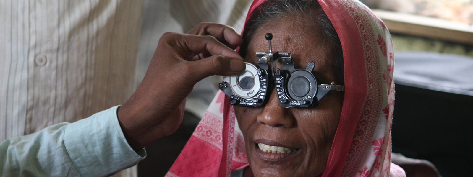 Doctor is checking a eyesight for women
