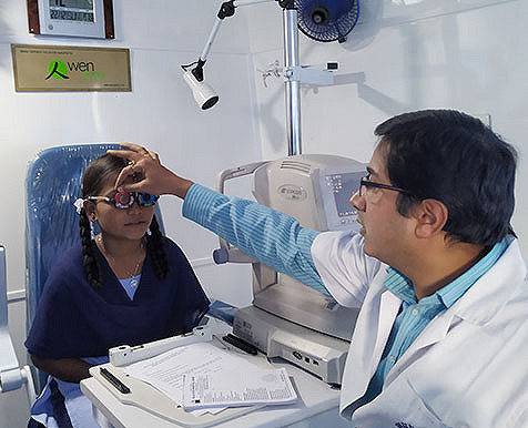 Opthalmologist conducting refraction test on a patient
