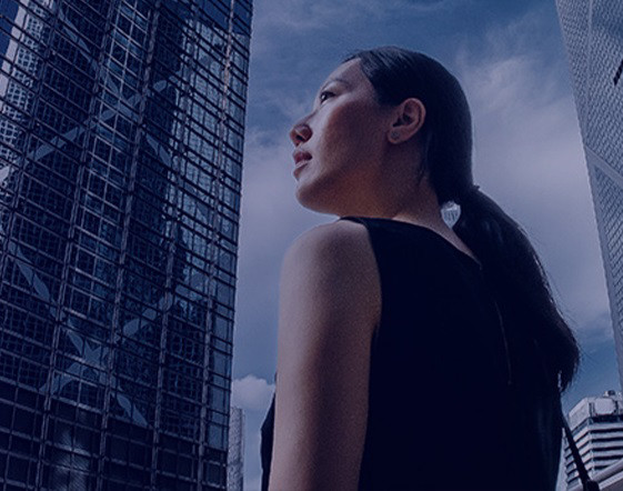 A woman looking at skycrapers