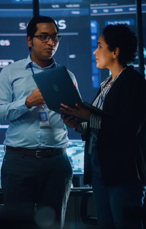 A man and woman in formals discussing serious business