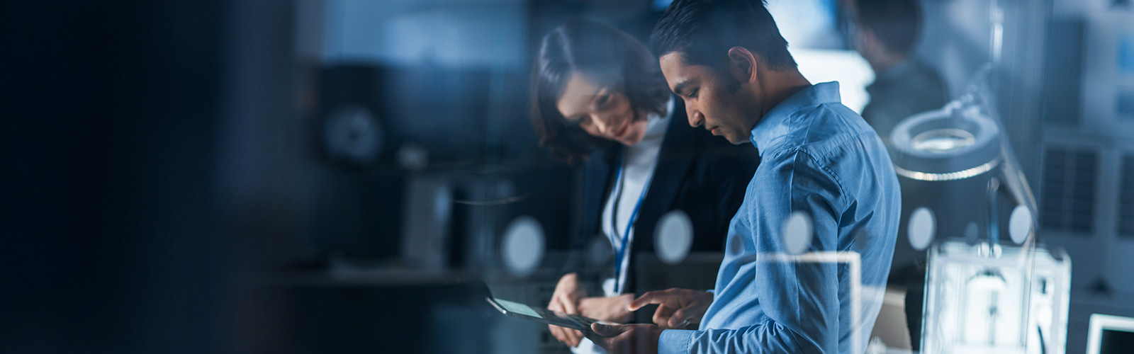 Business people having discussion with tablet in hand