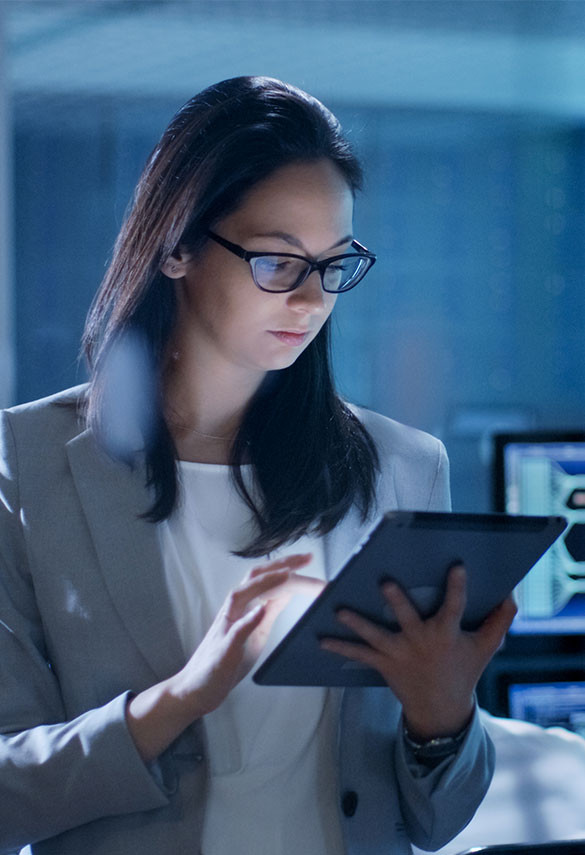 Woman with glasses looking at tablet screen