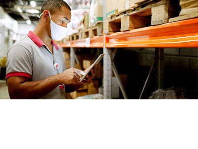 worker scrolling through a tablet