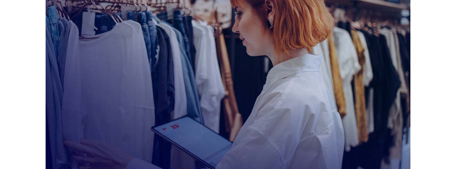 A person checking clothes at a retail store