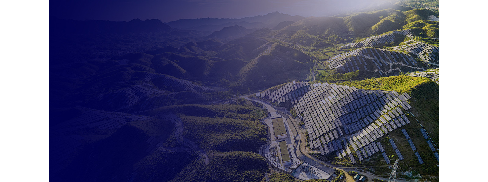 A picture of hills covered with solar panels