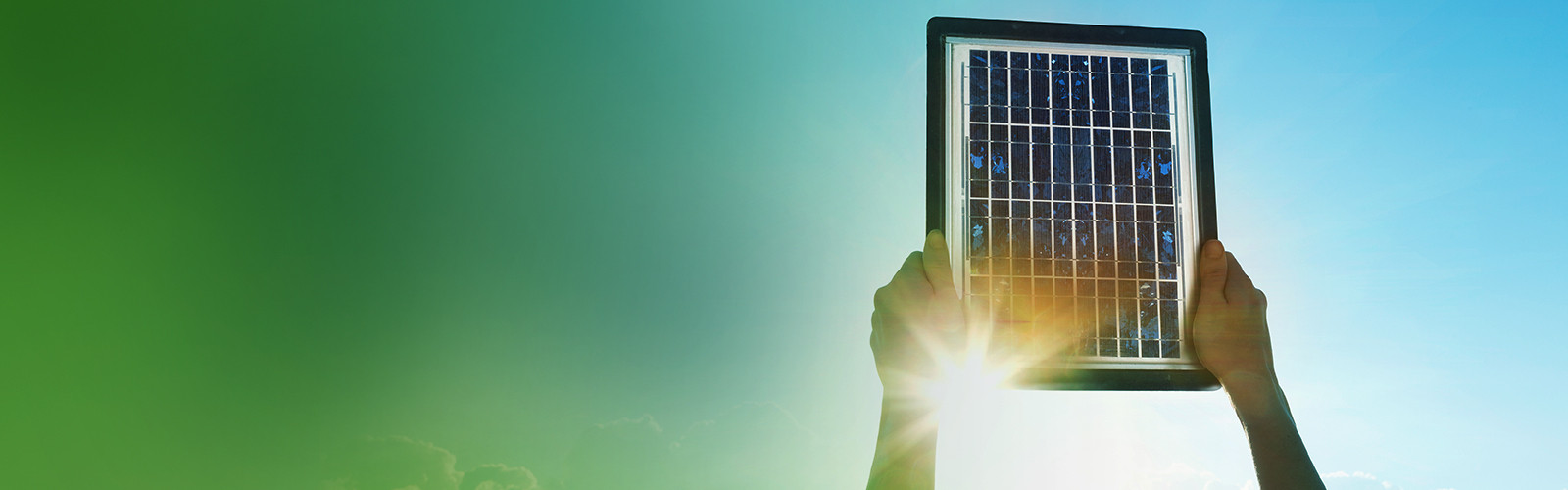 A solar panel held up to the sun