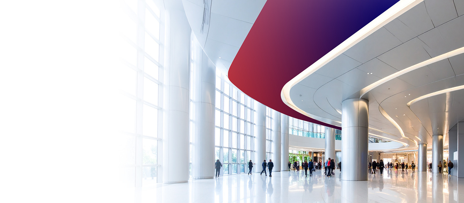 A woman wearing headphones stands in a bustling city