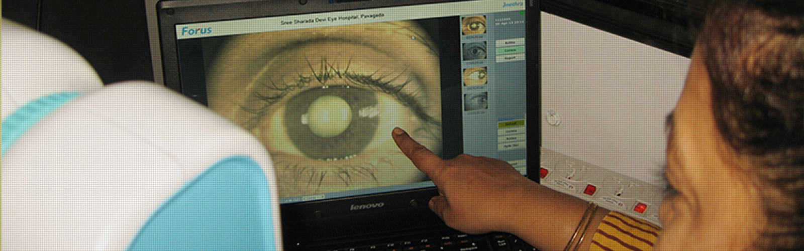 doctor is seeing a eye in laptop