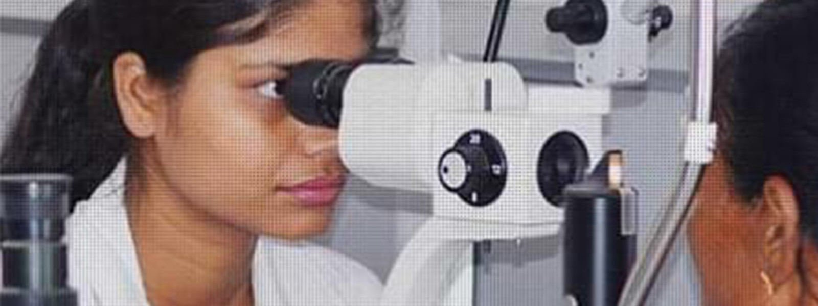 Doctor is checking eye sight for women