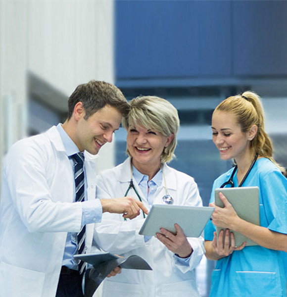 Colleagues of doctors looking at tablet device