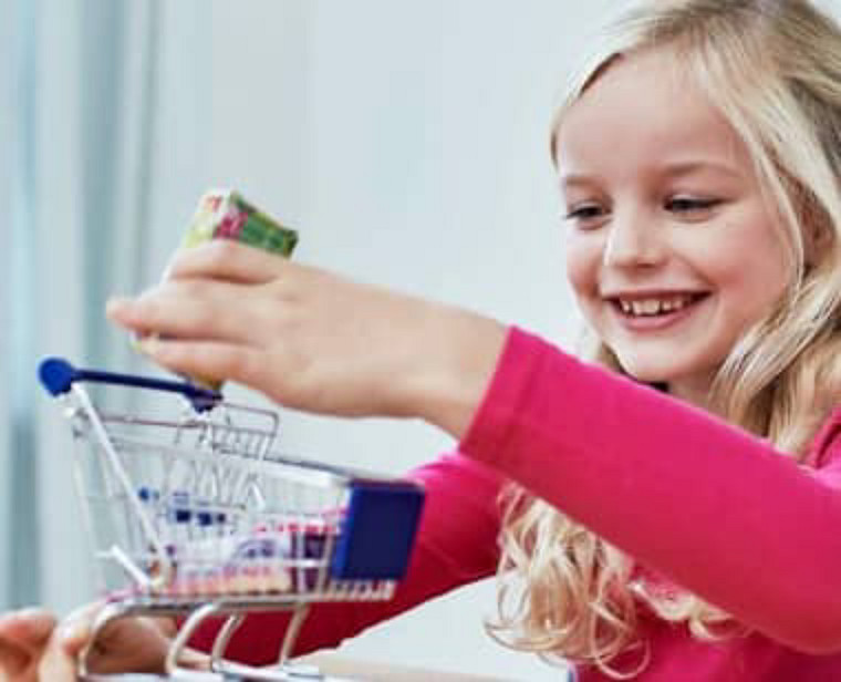 young girl with a packet of cookie