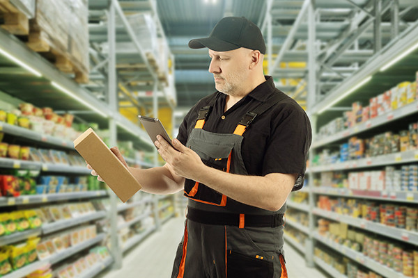 A man scanning box in a super market
