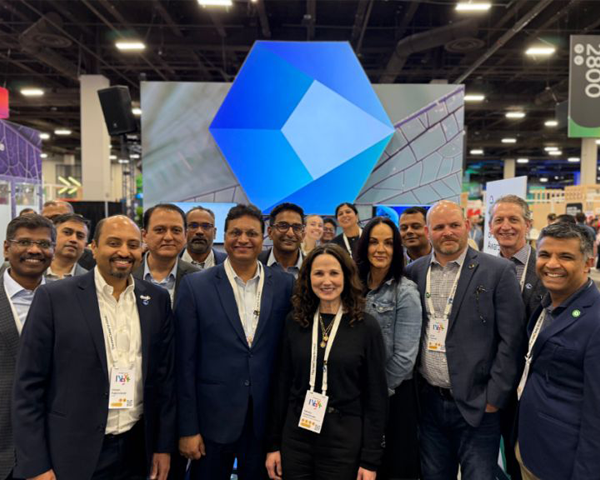 A team standing on a stage at an event