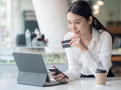 woman with card and mobile shopping online