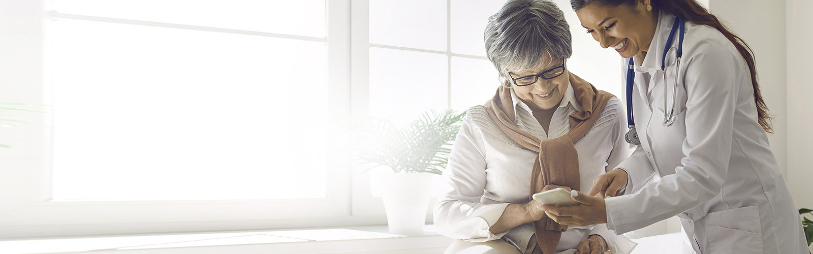 Two women looking at mobile