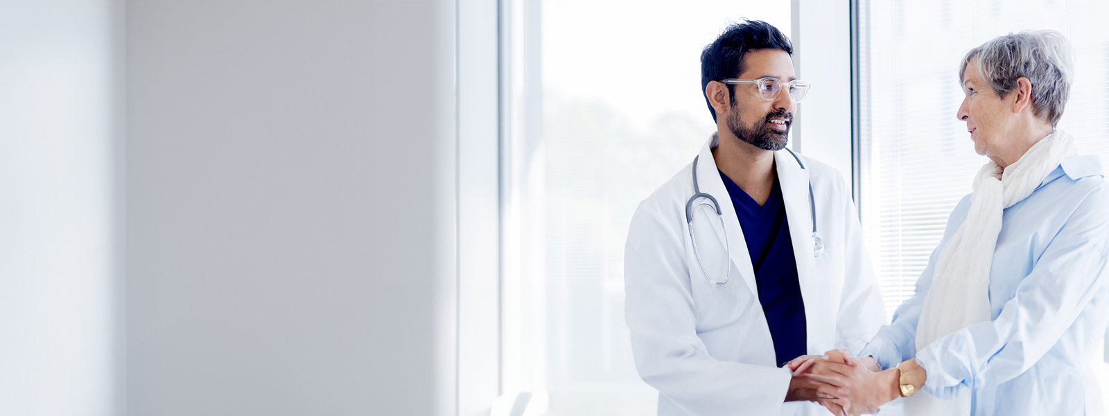 A medical professional and a woman talking