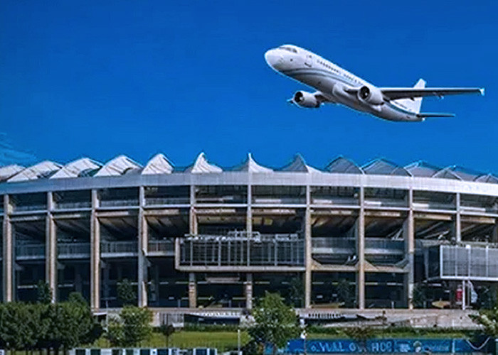 an airplane flying over an airport