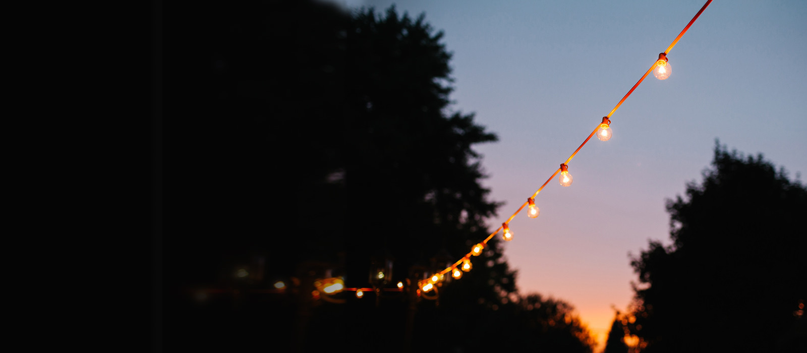 a row of lights in a night background
