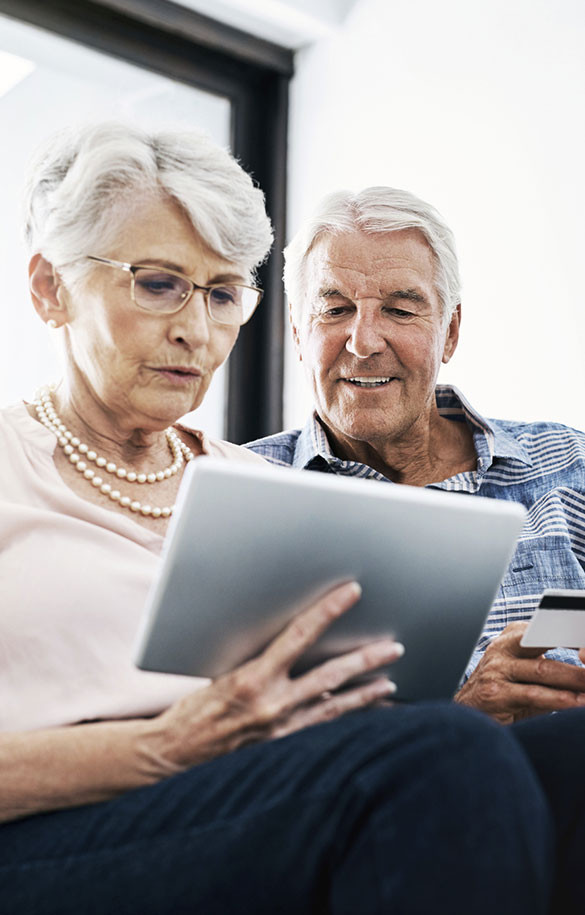 Man and woman looking at tablet