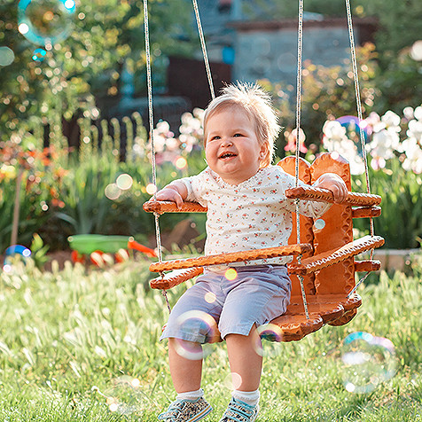 A cute child on a swing