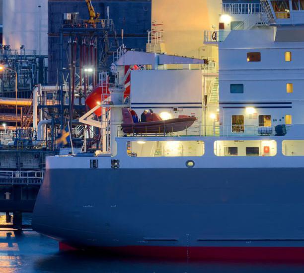 A zoomed in photo of a container ship from the side